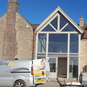 Our underfloor heating installers van parked by a house in shropshire