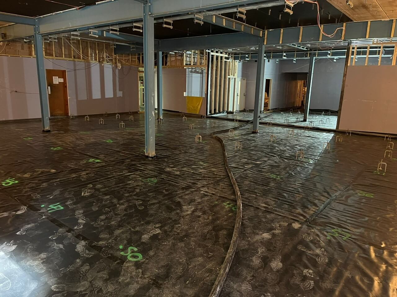 Laser level in progress before liquid screed