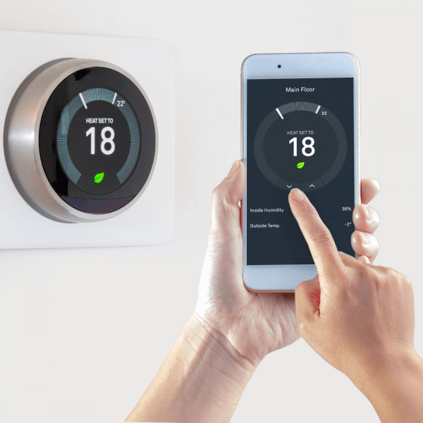 a smart underfloor heating thermostat being controlled by a mobile phone app