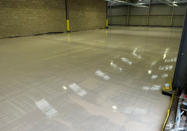 A warehouse with fresh liquid floor screed in Liverpool